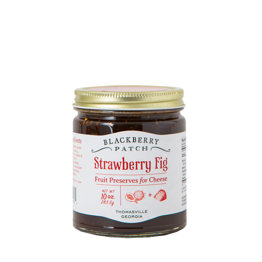 10oz glass jar of Blackberry Patch Strawberry Fig Fruit Preserves for Cheese with gold screw on lid. 