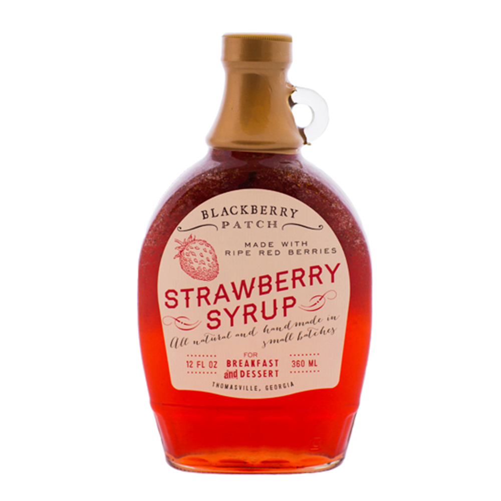 12oz glass jar of Blackberry Patch Classic Strawberry Syrup with pour handle. 