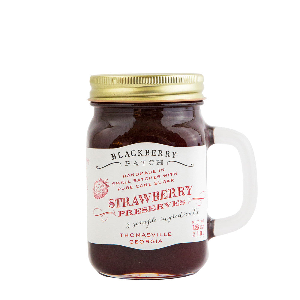 19oz jar of Blackberry Patch Strawberry Preserves. Jar is a handled mug with gold screw top. 