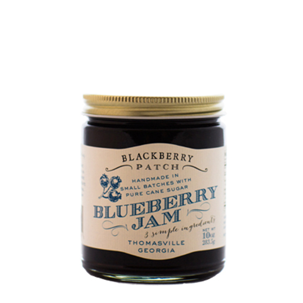 10oz jar of Blackberry Patch Blueberry Jam with gold screw on lid. 