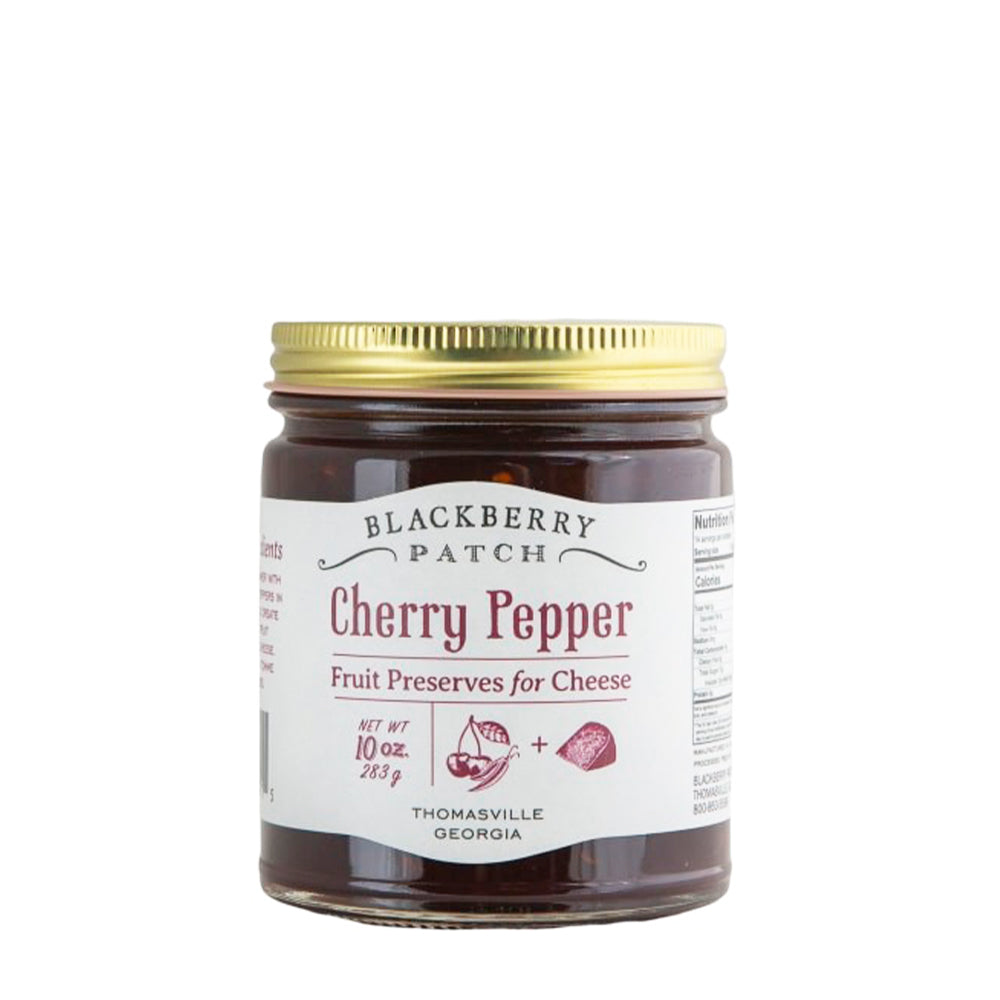 10oz glass jar of Blackberry Patch Cherry Pepper Fruit Preserves for Cheese with gold screw on lid. 
