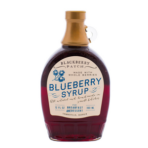 12oz glass jar of Blackberry Patch Classic Blueberry Syrup with pour handle. 
