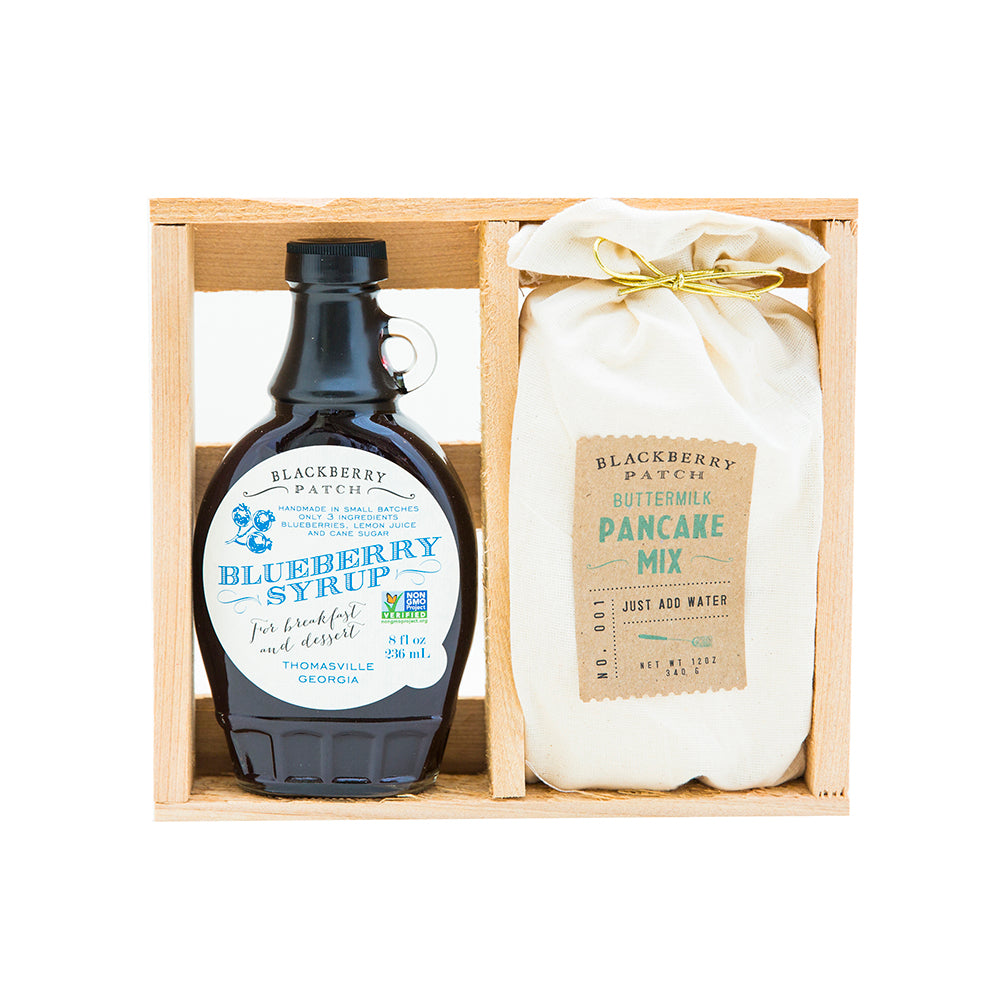 Premium Pancake gift crate includes one 8oz bottle of Blackberry Patch Premium Syrup and one 12 oz bag of pancake mix in a wooden gift crate. 