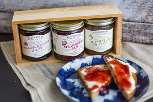Photo of strawberry jam in use on toast. 