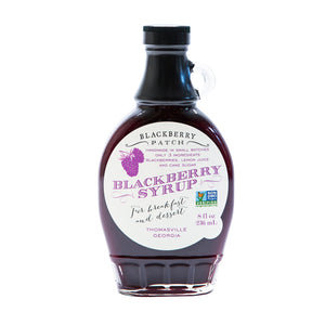 8oz glass jar of Blackberry Patch Premium Blackberry Syrup with pour handle. 3 Simple Ingredients.