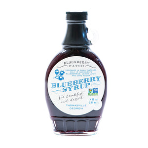 8oz glass jar of Blackberry Patch Premium Blueberry Syrup with pour handle. 3 Simple Ingredients.