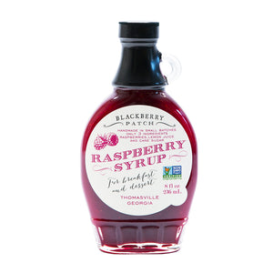 8oz glass jar of Blackberry Patch Premium Raspberry Syrup with pour handle. 3 Simple Ingredients.