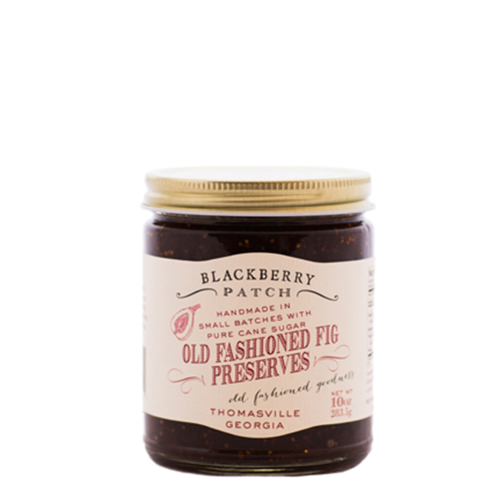 10oz glass jar of Blackberry Patch Old Fashioned Fig Preserves with gold screw on lid. 